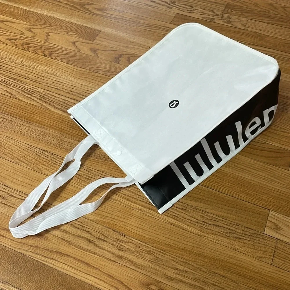 Lululemon reusable tote Snap closure. Black and white. 16” long x 14” wide x 6”
